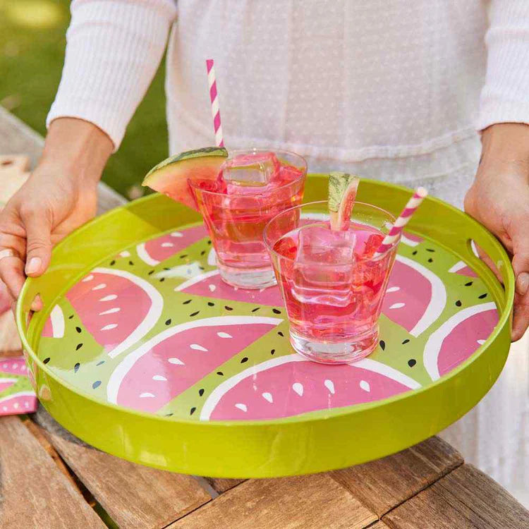 woman wearing blue blouse and watermelon table setting